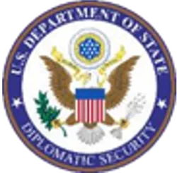 Seal of the U.S. Department of State, featuring an eagle, olive branch, and shield.