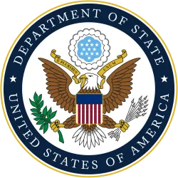 Seal of the United States Department of State featuring an eagle with shield, olive branch, arrows, and banner.