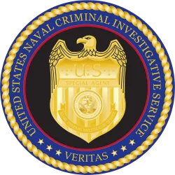 Seal of the United States Naval Criminal Investigative Service with gold eagle and badge on blue background