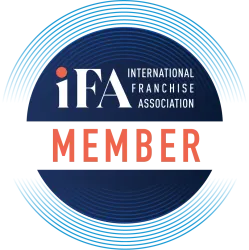 Member logo of the International Franchise Association featuring bold letters on a circular design.