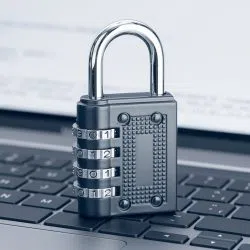 a silver key chain on a keyboard