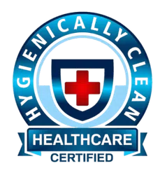 Blue circular badge with red cross and shield symbol labeled hygienically clean healthcare certified