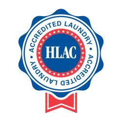 Blue and red HLAC Accredited Laundry seal with stars and ribbon badge design