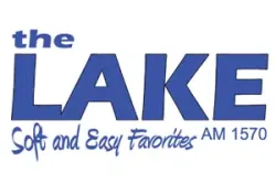 The Lake AM 1570 radio station logo with blue text and the slogan Soft and Easy Favorites.