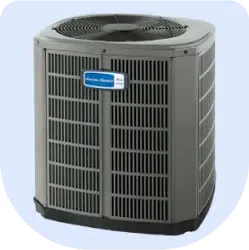 Outdoor central air conditioning unit with metal grille and fan on top against a light background
