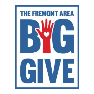 The Fremont Area Big Give logo featuring a red hand with a heart between bold blue letters.
