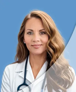 Confident female doctor in white coat with stethoscope against blue medical background.