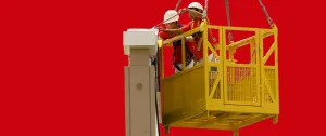 Workers in safety gear operating a yellow suspended work platform against a red background.
