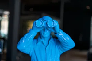 toy soldier looking through binoculars