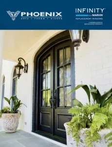 Black iron front entry doors with glass and arched top on white brick house with black iron style porch lights on either side.