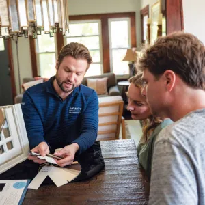 North Georgia Replacement Windows Consultant explains available discounts and financing options to homeowners