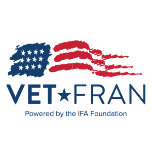 VetFran logo with stylized American flag and text powered by the IFA Foundation in blue and red colors
