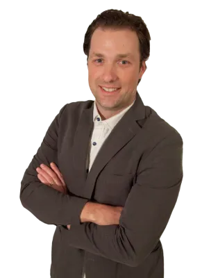 a man in a suit with his arms crossed