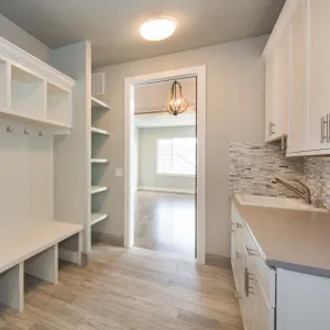 a kitchen with white cabinets