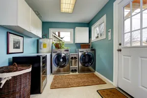 a small kitchen with a washer and dryer