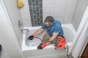a man washing his hands in a sink