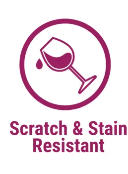 Icon of a wine glass with liquid drop symbolizing scratch and stain resistance in purple circle.