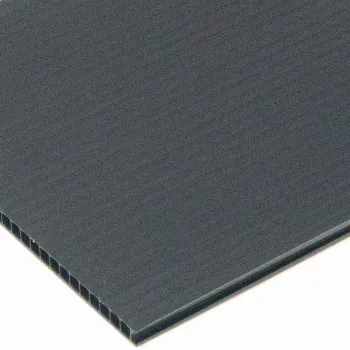 Close-up of black corrugated plastic sheet showing hollow fluted structure and smooth surface