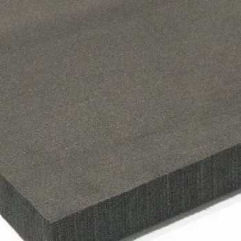 Close-up of a thick dark grey foam sheet with a smooth surface and rectangular shape.