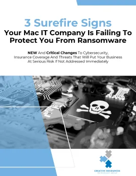 Warning sign with skull on computer circuit board indicating ransomware risks for Mac IT companies.