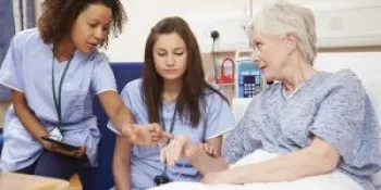 Nurses helping patient
