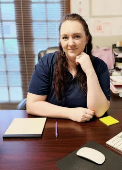maidpro baton rouge cleaning pro sitting at a desk ready for the day
