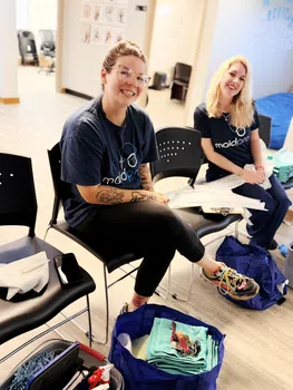 maidpro baton rouge house cleaners posing for a photo during a team meeting