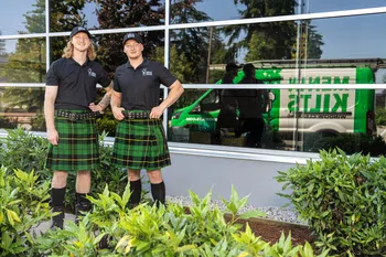 two people wearing kilts