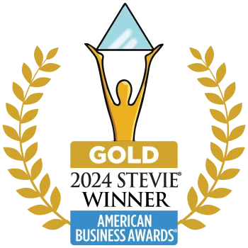 Gold 2024 Stevie Award winner emblem with laurel wreath and blue triangle held by a golden figure.