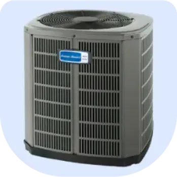 Gray outdoor central air conditioning unit with visible fan and metal grille on light background