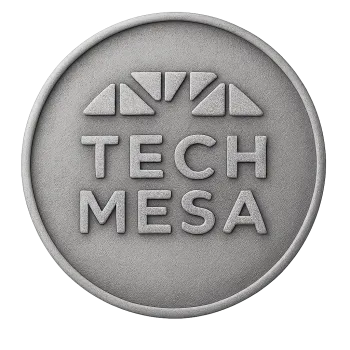 Round gray stone emblem with TECH MESA text and abstract geometric design above it