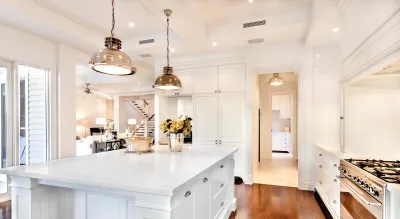 a kitchen with white cabinets