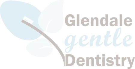 Logo of Glendale Gentle Dentistry with stylized leaves and toothbrush in soft blue and gray colors