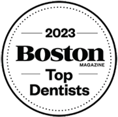 2023 Boston Magazine Top Dentists badge in a black and white circular design