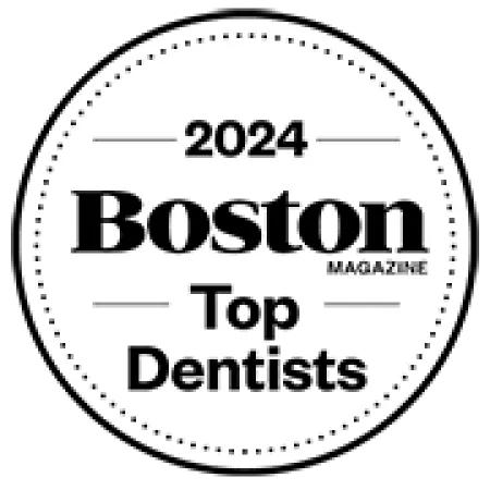 2024 Boston Magazine Top Dentists circular badge award logo in black and white design
