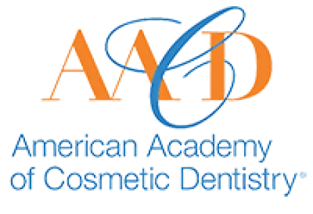American Academy of Cosmetic Dentistry logo with orange and blue lettering on a white background