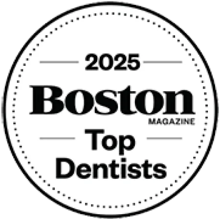 2025 Boston Magazine Top Dentists badge with dotted circle border in black and white.
