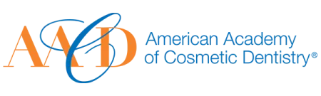 Logo of American Academy of Cosmetic Dentistry with orange and blue letters AACD and full name text