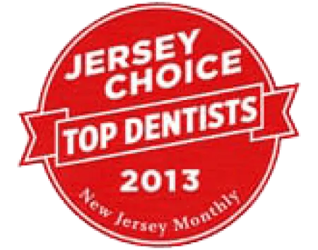 Red circular badge reading Jersey Choice Top Dentists 2013 from New Jersey Monthly magazine