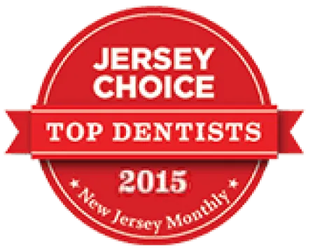 Red badge with ribbon stating Jersey Choice Top Dentists 2015 by New Jersey Monthly