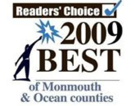 2009 Readers' Choice Best of Monmouth and Ocean counties award with person reaching towards star graphic.