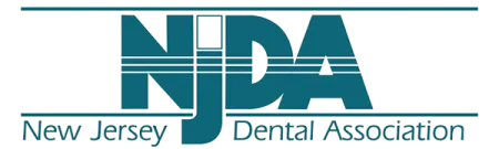 Logo of New Jersey Dental Association with NJDA letters and full association name below in teal.