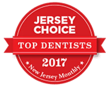 Red circular badge reading Jersey Choice Top Dentists 2017 awarded by New Jersey Monthly magazine