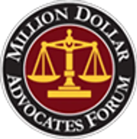 Million Dollar Advocates Forum logo with gold scales of justice on burgundy background and black circular border.