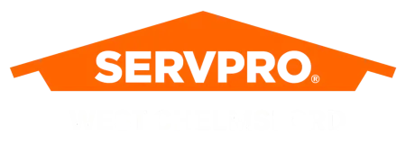 SERVPRO logo with orange roof shape and bold text WEST CHELMSFORD below