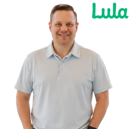 Smiling man in light blue polo shirt standing next to a green Lula logo on a transparent background