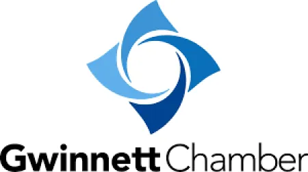 Gwinnett Chamber logo with four interlocking shapes in varying shades of blue above black and gray text.