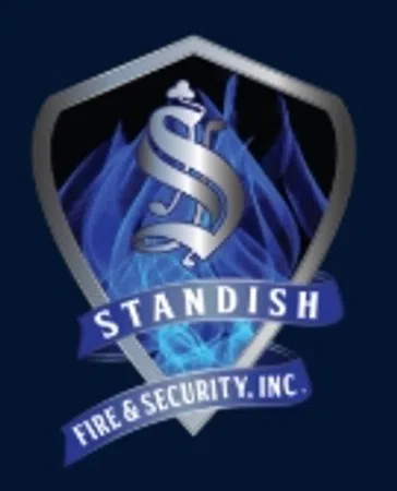 Metallic shield logo with a silver 'S', blue flames background, and banners reading Standish Fire & Security, Inc.