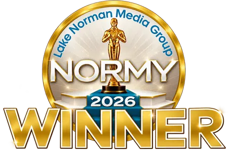 Gold and blue 2026 Normy Winner emblem with a statuette and Lake Norman Media Group text