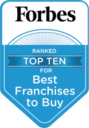 Forbes badge showing top ten ranking for best franchises to buy with blue and white design.